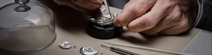 Detail of a Rolex watchmaker servicing a watch