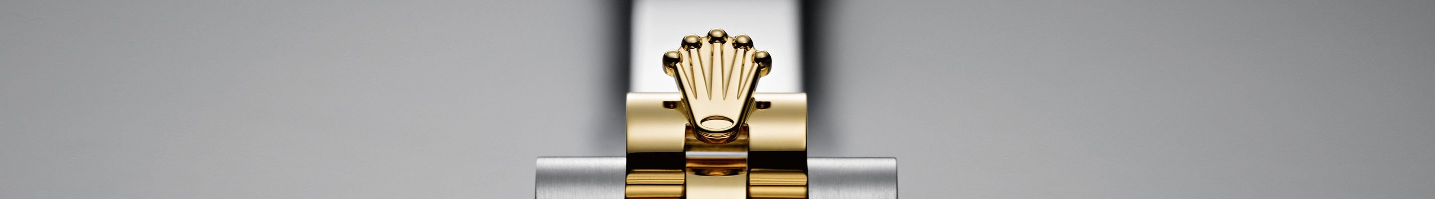 Detail showing golden Rolex Crown