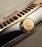 Detail of Rolex Crown on a close-up gold watch