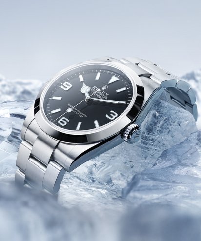 Atmospheric image of a Rolex Explorer set against snowy mountain peaks